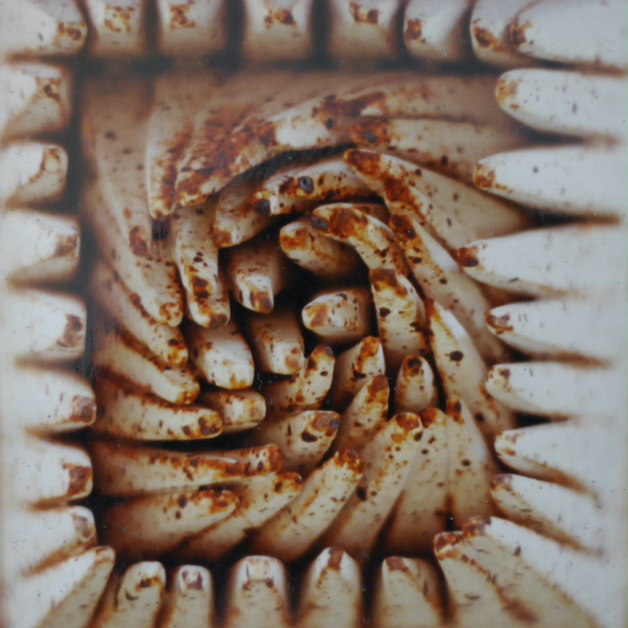 contemporary fine art ceramic of a warped grid of pyramids by Christian Dodd