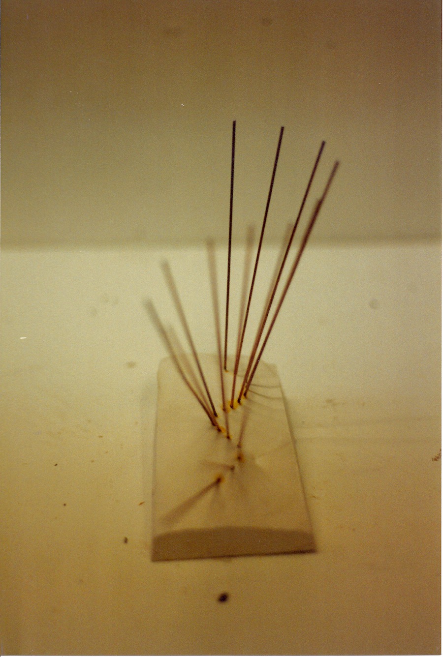 contemporary fine art sculpture of metal rods in a wave form by Christian Dodd